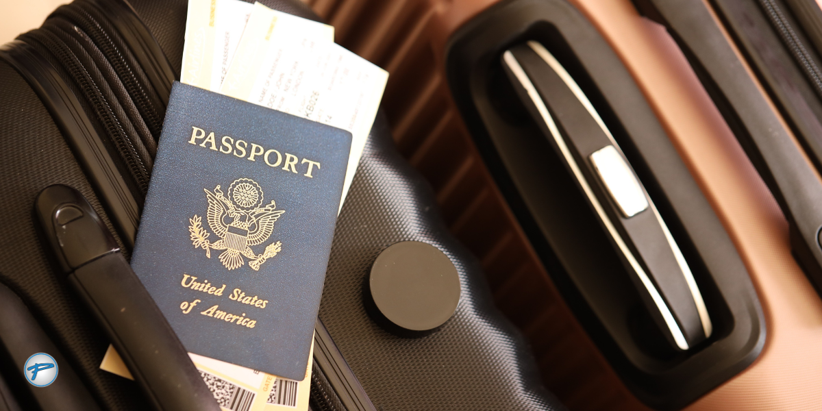 Close-up of U.S. passports and travel documents on a suitcase, symbolizing international travel readiness and Peak Limo’s trusted global travel service.
